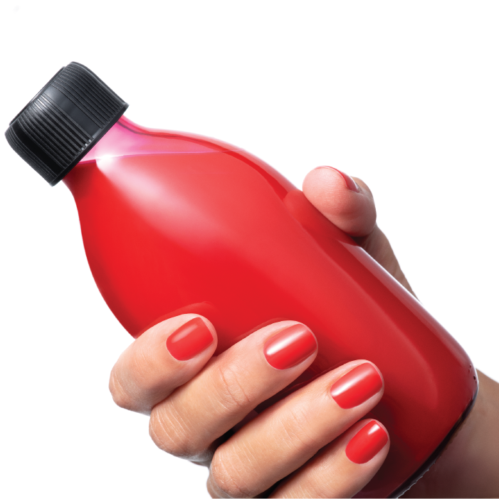 Picture of a hand with painted nails holding a red bottle