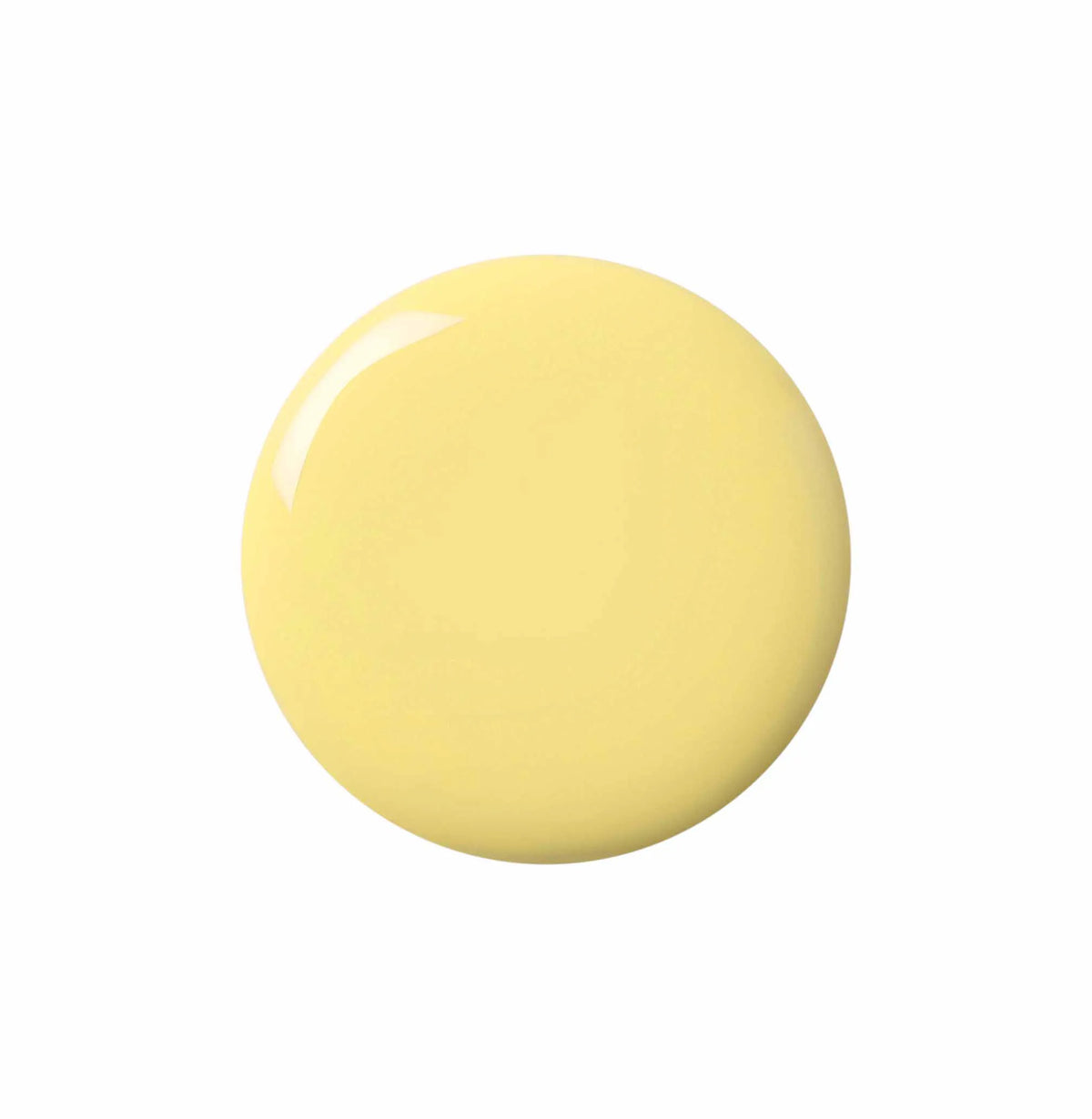 A smooth, glossy circular color swatch in a pale pastel yellow, shown on a solid white background.